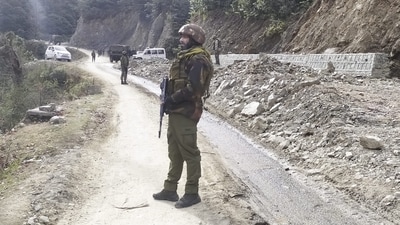 Army personnel stand guard near the site where two Army vehicles were ambushed by terrorists on Thursday in Poonch district, (PTI) Army personnel stand guard near the site where two Army vehicles were ambushed by terrorists on Thursday in Poonch district, (PTI)
