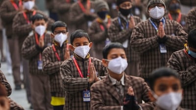 School students wear face masks during prayer amid rise in Covid-19 cases in the country, in Jammu on Friday (PTI) School students wear face masks during prayer amid rise in Covid-19 cases in the country, in Jammu on Friday (PTI)