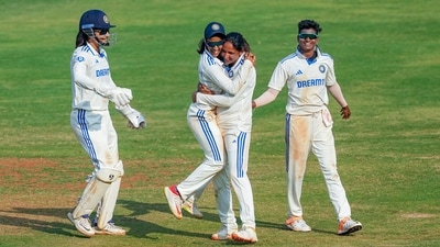 Harmanpreet Kaur celebrates with teammates after taking the wicket of Australia Women�s Tahlia McGrath on the third day of the one-off Test cricket match between India Women and Australia Women (PTI) Harmanpreet Kaur celebrates with teammates after taking the wicket of Australia Women�s Tahlia McGrath on the third day of the one-off Test cricket match between India Women and Australia Women (PTI)