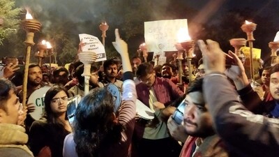 JNU students' outfits hold torches during a march on campus against the revised Chief Proctor Office (CPO) manual which imposes stringent measures like penalising protests in selected areas of the campus, in New Delhi. (PTI) JNU students' outfits hold torches during a march on campus against the revised Chief Proctor Office (CPO) manual which imposes stringent measures like penalising protests in selected areas of the campus, in New Delhi. (PTI)