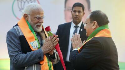 Prime Minister Narendra Modi being welcomed by BJP president JP Nadda as he arrives to attend the BJP national office bearers' meeting, at the party office in New Delhi on Friday. (JP Nadda-X/ANI)