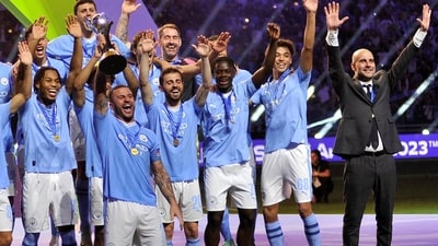 Manchester City's Kyle Walker lifts the trophy alongside teammates after winning the Club World Cup final (REUTERS)