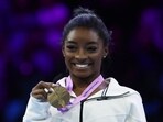 Gymnastics - 2023 World Artistic Gymnastics Championships - Sportpaleis, Antwerp, Belgium - October 8, 2023 Gold medallist Simone Biles of the U.S. celebrates during the medal ceremony after winning the floor exercise at the women's apparatus finals.