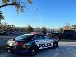 In this photo provided by the Ocala Police Department, a cruiser sits parked following a fatal shooting at Paddock Mall in Ocala, Fla., located about 80 miles northwest of Orlando, Saturday, Dec. 23, 2023. In this photo provided by the Ocala Police Department, a cruiser sits parked following a fatal shooting at Paddock Mall in Ocala, Fla., located about 80 miles northwest of Orlando, Saturday, Dec. 23, 2023.
