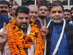 BJP MP Brij Bhushan Sharan Singh with the newly-elected president of the Wrestling Federation of India (WFI) Sanjay Singh at the former's residence