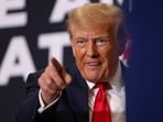 FILE PHOTO: Republican presidential candidate and former U.S. President Donald Trump attend a Waterloo, Iowa campaign event. REUTERS/Scott Morgan/File Photo