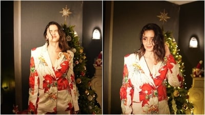Alia's pantsuit features a blazer with full-length sleeves, padded shoulders, a V-neckline, notch lapel collars, front button closures, and a tailored fitting. She styled the jacket with matching pants featuring a high-rise waist and a flared fitting. The off-white outfit features sequin embellishments and a floral pattern in red, green, and mustard hues. (Instagram) Alia's pantsuit features a blazer with full-length sleeves, padded shoulders, a V-neckline, notch lapel collars, front button closures, and a tailored fitting. She styled the jacket with matching pants featuring a high-rise waist and a flared fitting. The off-white outfit features sequin embellishments and a floral pattern in red, green, and mustard hues. (Instagram)