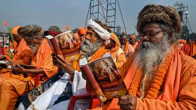 Devotees participate in 'Lokkho Kanthe Gita Path' event, at Brigade Parade Ground in Kolkata (PTI) Devotees participate in 'Lokkho Kanthe Gita Path' event, at Brigade Parade Ground in Kolkata (PTI)