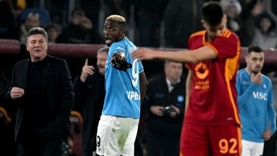Napoli's Nigerian forward #09 Victor Osimhen (C) walks off the pitch after a red card (AFP) Napoli's Nigerian forward #09 Victor Osimhen (C) walks off the pitch after a red card (AFP)