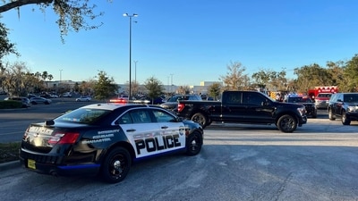 In this photo provided by the Ocala Police Department, a cruiser sits parked following a fatal shooting at Paddock Mall in Ocala, Fla., located about 80 miles northwest of Orlando, Saturday, Dec. 23, 2023. (AP) In this photo provided by the Ocala Police Department, a cruiser sits parked following a fatal shooting at Paddock Mall in Ocala, Fla., located about 80 miles northwest of Orlando, Saturday, Dec. 23, 2023. (AP)