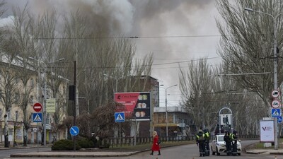 Smoke rises over buildings in an aftermath of recent shelling in Russian-controlled Ukraine. (AFP) Smoke rises over buildings in an aftermath of recent shelling in Russian-controlled Ukraine. (AFP)