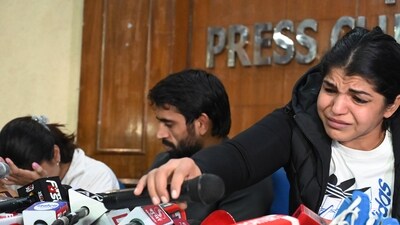 Wrestlers Vinesh Phogat , Bajrang Punia and Sakshi Malik during a press conference at Press Club of India , in New Delhi, India, on Thursday, December 21, 2023. (Hindustan Times)