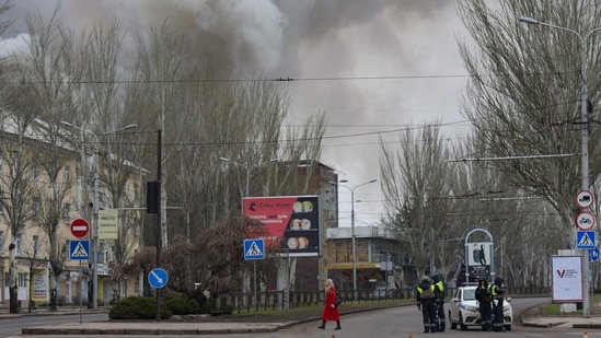 Smoke rises over buildings in an aftermath of recent shelling in Russian-controlled Ukraine. (AFP)