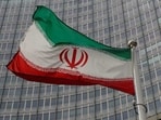An Iranian flag flutters.