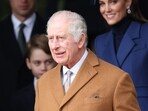 Britain's King Charles III waits on the church steps after attending the Royal Family's traditional Christmas Day service. Britain's King Charles III waits on the church steps after attending the Royal Family's traditional Christmas Day service.