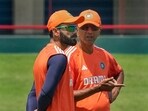 Virat Kohli with coach Rahul Dravid during a practice session ahead of the first Test cricket match between India and South Africa. Virat Kohli with coach Rahul Dravid during a practice session ahead of the first Test cricket match between India and South Africa.