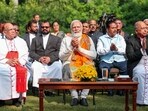 Prime Minister Narendra Modi with Christian community members during Christmas celebrations at 7, Lok Kalyan Marg, in New Delhi, Monday, Dec. 25, 2023. (PTI Photo)