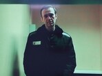 Russian opposition leader Alexei Navalny is seen on a screen via video link from a penal colony.
