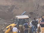 Rescue efforts are underway to save trapped workers after an under-construction temple wall collapsed on Monday in Gurugram.