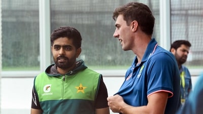Australia's captain Pat Cummins (R) chats with Pakistan's batsman Babar Azam during a training session (AFP) Australia's captain Pat Cummins (R) chats with Pakistan's batsman Babar Azam during a training session (AFP)