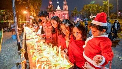 Devotees lighting candles at Sacred Heart Cathedral Church during Christmas Day celebrations in New Delhi, India, on Monday. (HT Photo/ Raj K Raj) Devotees lighting candles at Sacred Heart Cathedral Church during Christmas Day celebrations in New Delhi, India, on Monday. (HT Photo/ Raj K Raj)