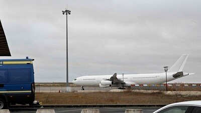 The Airbus A340 which was grounded over suspected "human trafficking" at Vatry airport in France. (AFP) The Airbus A340 which was grounded over suspected "human trafficking" at Vatry airport in France. (AFP)