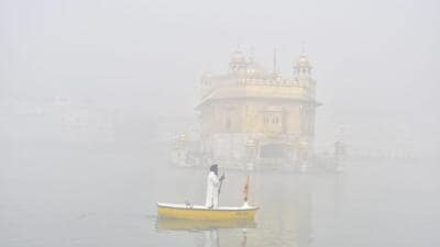 Golden Temple enveloped in dense fog on Monday. Amritsar recorded a low of 7.2 degrees Celsius. (Sameer Sehgal/HT)