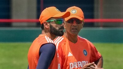 Virat Kohli with coach Rahul Dravid during a practice session ahead of the first Test cricket match between India and South Africa. (PTI)