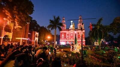 Devotees lighting candles at Sacred Heart Cathedral Church during Christmas celebrations in New Delhi, India, on Monday. (HT Photo/ Raj K Raj) Devotees lighting candles at Sacred Heart Cathedral Church during Christmas celebrations in New Delhi, India, on Monday. (HT Photo/ Raj K Raj)