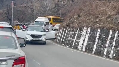 Man driving car with doors open in Manali. (X/@shubhamtorres09)