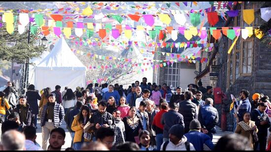 Tourists throng the Ridge in Shimla on Christmas. As many as 45,000 vehicles entered the town in the past three days. (Deepak Sansta/HT)