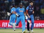 India's Rohit Sharma and Afghanistan's Naveen Ul Haq (R)
India's Rohit Sharma and Afghanistan's Naveen Ul Haq (R)