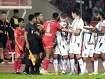 Players of North East United FC (in Red) and Mohun Bagan Super Giant (in white) clash during the Indian Super League (ISL) 2023-24 football match
