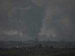 Smoke rises following an Israeli bombardment in the Gaza Strip, as seen from southern Israel, Tuesday, Dec. 26, 2023. The army is battling Palestinian militants across Gaza in the war ignited by Hamas' Oct. 7 attack into Israel. (AP Photo/Leo Correa)