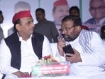 Samajwadi Party president Akhilesh Yadav and party leader Swami Prasad Maurya. (Deepak Gupta/HT Photo)