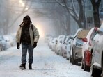 FILE - A man walks in the snow-covered street in Boston, Saturday, Jan. 29, 2022. (AP Photo/Michael Dwyer, File) FILE - A man walks in the snow-covered street in Boston, Saturday, Jan. 29, 2022. (AP Photo/Michael Dwyer, File)