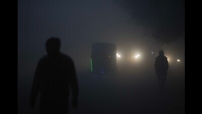 A ‘very dense’ fog blanketed Delhi for a second day and reduced visibility to 50 metres in parts of the city on Tuesday morning. (PTI)