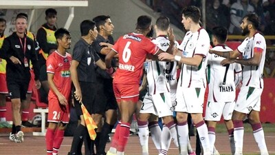 Players of North East United FC (in Red) and Mohun Bagan Super Giant (in white) clash during the Indian Super League (ISL) 2023-24 football match (Pitamber Newar) Players of North East United FC (in Red) and Mohun Bagan Super Giant (in white) clash during the Indian Super League (ISL) 2023-24 football match (Pitamber Newar)