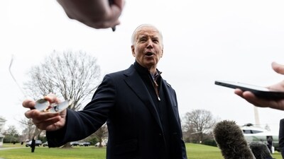 US president Joe Biden speaks to members of the media before boarding Marine One in Washington. (Bloomberg)
