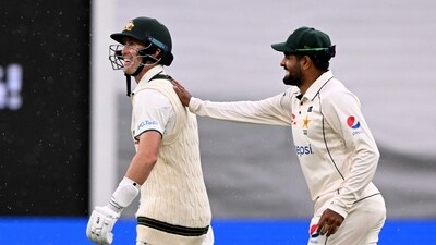 Australia's batsman Marnus Labuschagne (L) is patted on the back by Pakistan's Barbar Azam (L) (AFP) Australia's batsman Marnus Labuschagne (L) is patted on the back by Pakistan's Barbar Azam (L) (AFP)