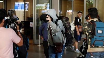 A passenger from Nicaragua bound Airbus A340 flight that was grounded in France on suspicion of human trafficking, evades the media as he leaves the Chhatrapati Shivaji Maharaj International Airport after his arrival, in Mumbai, (REUTERS)