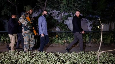 Israeli embassy officials and members of the security forces check the area, following a reported explosion. (Reuters)