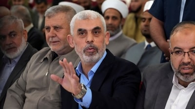 Israel-Hamas War: Yahya Sinwar, head of Hamas in Gaza, greets his supporters upon his arrival at a meeting in a hall on the sea side of Gaza City. (AP) Israel-Hamas War: Yahya Sinwar, head of Hamas in Gaza, greets his supporters upon his arrival at a meeting in a hall on the sea side of Gaza City. (AP)