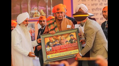 Jammu and Kashmir lieutenant governor Manoj Sinha being felicitated during a programme on ‘Veer Bal Diwas’ in Jammu on Tuesday. (PTI)