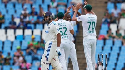 South Africa's Kagiso Rabada celebrates the wicket of India's captain Rohit Sharma on the first day of the first Test cricket match between India and South Africa, at SuperSport Park Stadium, in Centurion, Tuesday (PTI) South Africa's Kagiso Rabada celebrates the wicket of India's captain Rohit Sharma on the first day of the first Test cricket match between India and South Africa, at SuperSport Park Stadium, in Centurion, Tuesday (PTI)