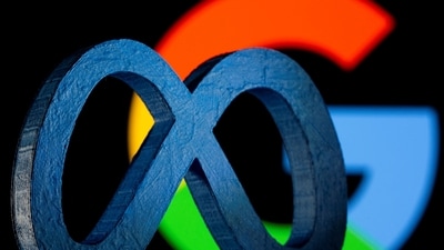 A 3D printed Facebook's new rebrand logo Meta is seen in front of displayed Google logo in this illustration. (REUTERS)