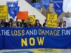 Activists demonstrate for the loss and damage fund at the COP28 U.N. Climate Summit, Wednesday, Dec. 6, 2023, in Dubai, United Arab Emirates. AP/PTI(AP12_06_2023_000286B)