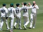 Australia's Nathan Lyon, right, is congratulated by teammates after taking the wicket of Pakistan's Imam-ul-Haq during the second day of their cricket test match in Melbourne Australia's Nathan Lyon, right, is congratulated by teammates after taking the wicket of Pakistan's Imam-ul-Haq during the second day of their cricket test match in Melbourne