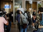 A passenger from Nicaragua bound Airbus A340 flight that was grounded in France on suspicion of human trafficking, evades the media as he leaves the Chhatrapati Shivaji Maharaj International Airport after his arrival, in Mumbai, (REUTERS)