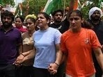 Indian wrestlers Bajrang Punia, Sakshi Malik, and Vinesh during a protest